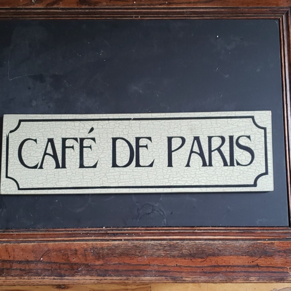 Bistro Style Cafe De Paris sign
